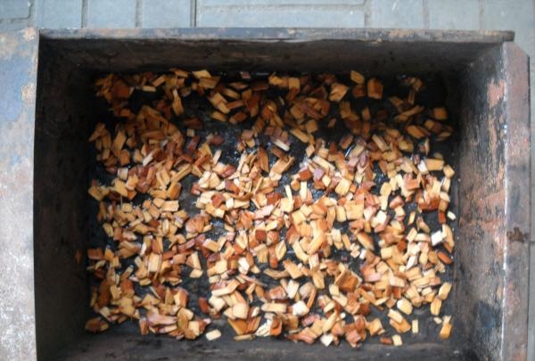sawdust at the bottom of the smokehouse