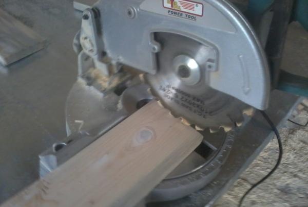 using a miter saw to trim a board