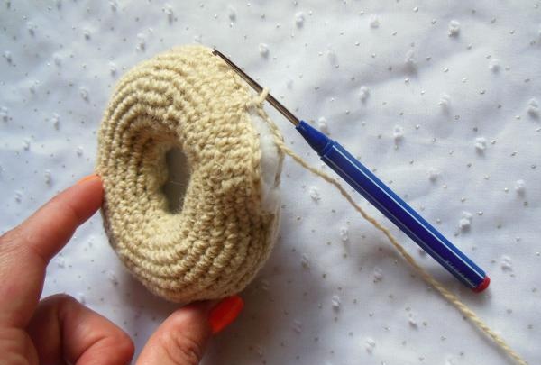 Crochet pincushion in the shape of a donut