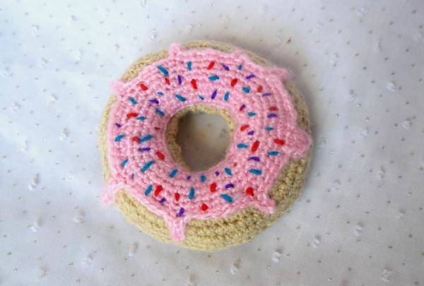Crochet pincushion in the shape of a donut