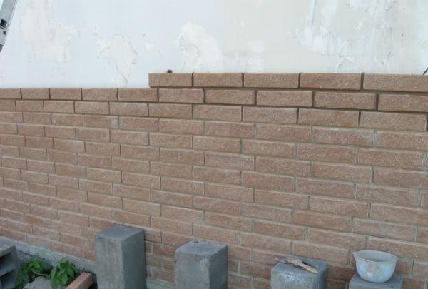 Afslutning af huset med mursten