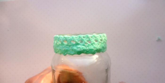 Glue along the edge of the jar