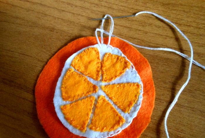 New Year's orange felt pendant