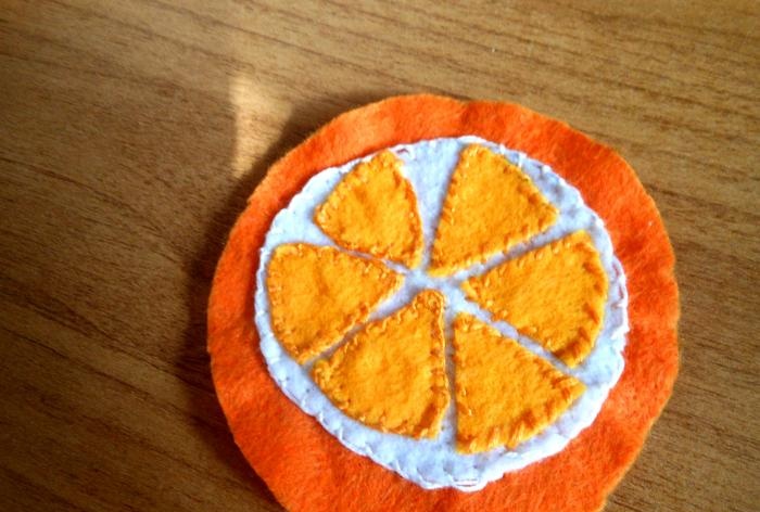 New Year's orange felt pendant