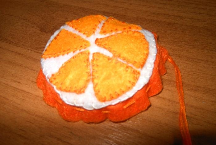 New Year's orange felt pendant