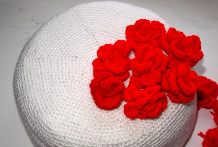 Three-tier cake with crocheted roses