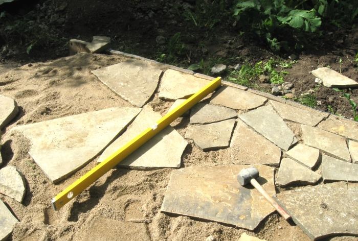 Pose du chantier en grès