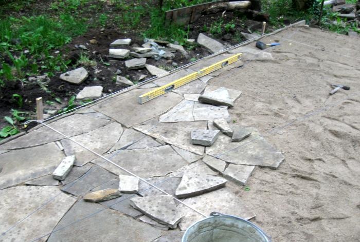 Laying the site with sandstone