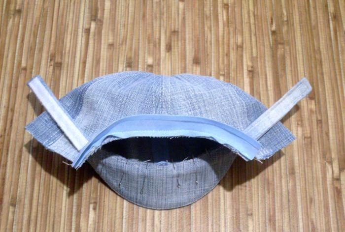 We sew a denim baseball cap for a baby