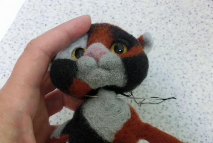 spotted cat made of wool felting