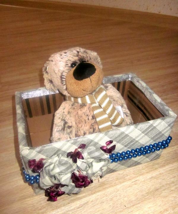 box with flowers and fabric