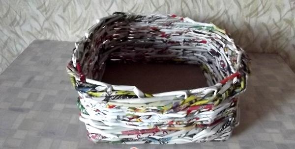 weaving a basket from a magazine vine