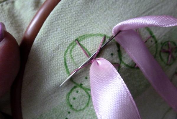 pass the ribbon over the first stitch