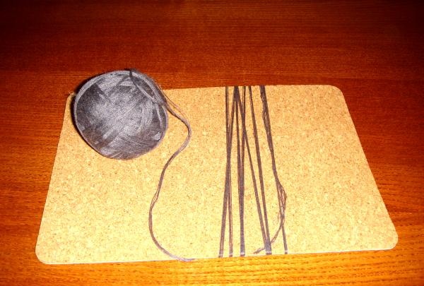 Doll amulet made of threads
