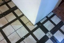 Installation of ceramic tiles on a flat surface