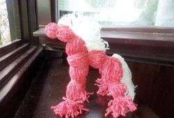 Red horse made of threads (motanka toy)