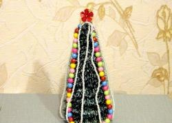 Christmas tree made of tinsel and jewelry