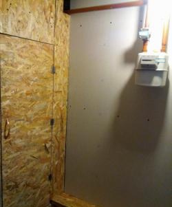 Sheathing the corridor with plasterboard and OSB boards