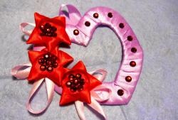 Volumetric valentine made of satin ribbons
