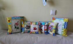 Potholders and pillows with embroidery