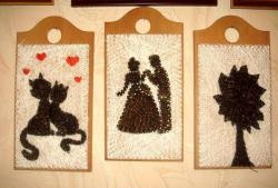 Quadre fet amb fils i claus "Una parella de gats enamorats"