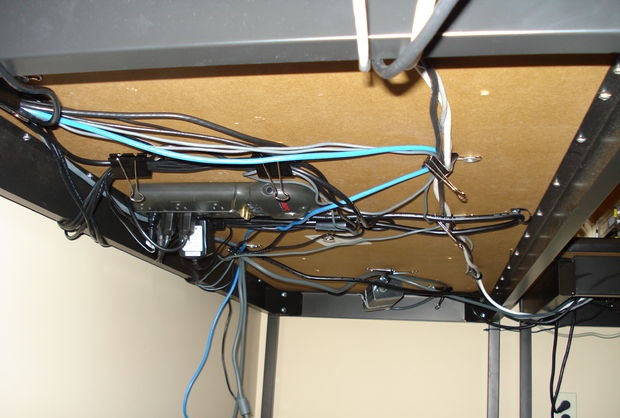 Hiding wires under a computer desk