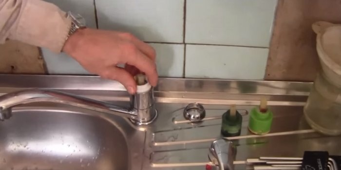 The faucet is leaking, fixing the problem
