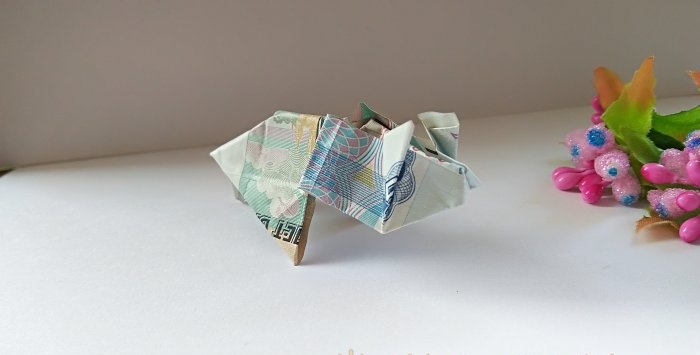 Schwein aus einer Banknote