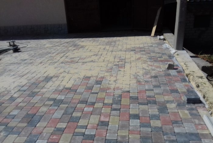 Driveway to the house made of paving slabs