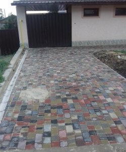 Driveway to the house made of paving slabs