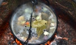 Delicious trout soup on the fire