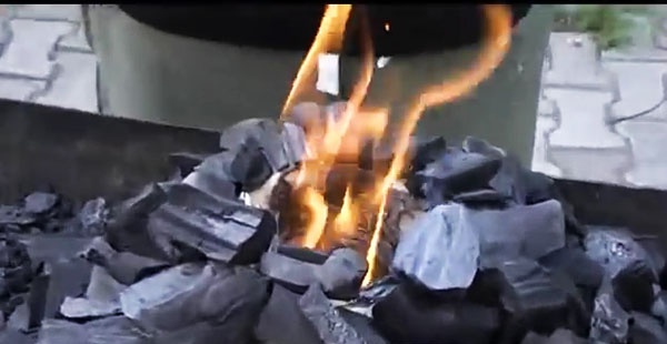 Method of lighting coals without lighter fluid
