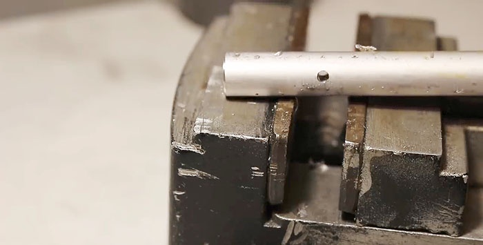 How to accurately drill a side hole in a round workpiece