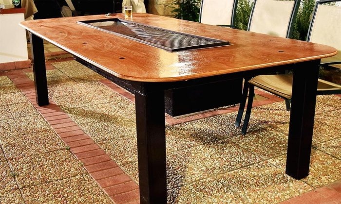 Homemade table with built-in barbecue