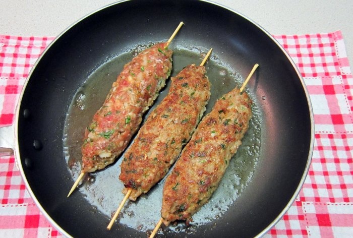 Pork kebab in a frying pan