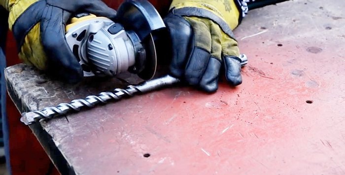 Hammers wooden stakes with a hammer drill