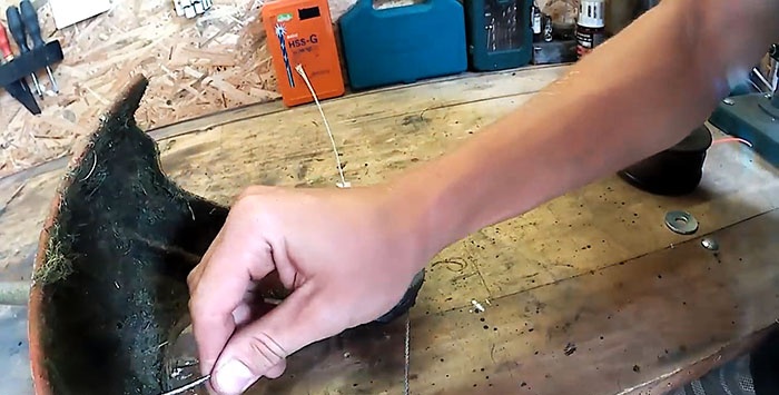 Kā nomainīt makšķerauklu trimmerā ar tērauda kabeli
