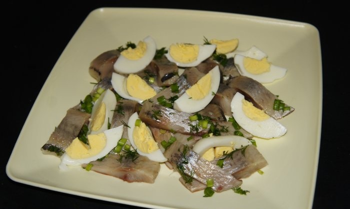 Russian salad of lightly salted herring and eggs