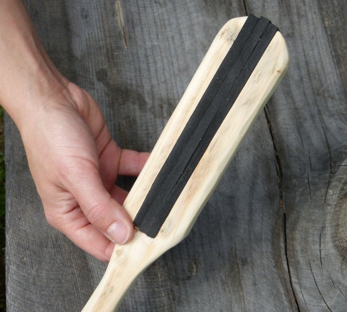 A homemade brush made from recycled materials that doesn't allow debris to stick to it.