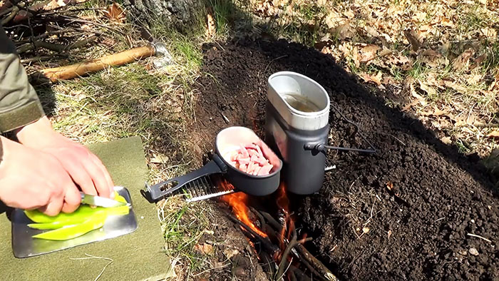 Picnic in nature delicious pasta on the fire