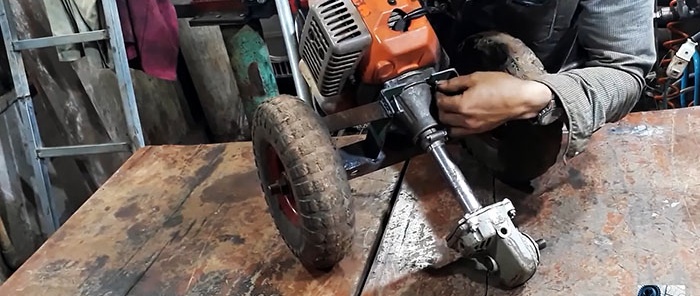 DIY trencher na ginawa mula sa isang brush cutter at isang sirang gilingan