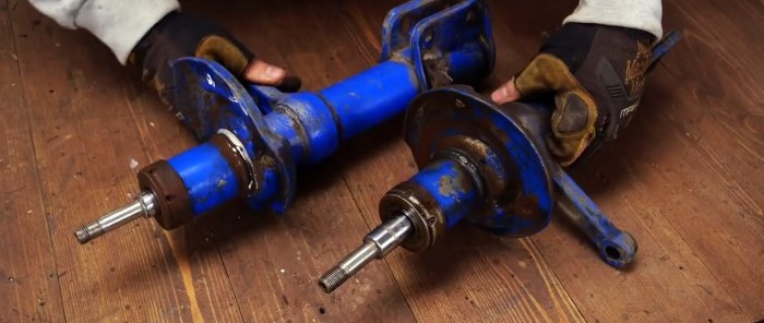 Hvordan lage en skjæremaskin av en vinkelsliper og gamle støtdempere