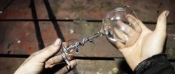 How to wrap a nail around the stem of a glass