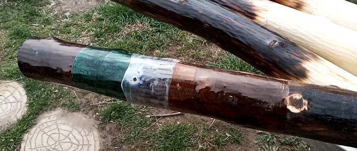 Protecting wooden poles with PET bottles for pennies