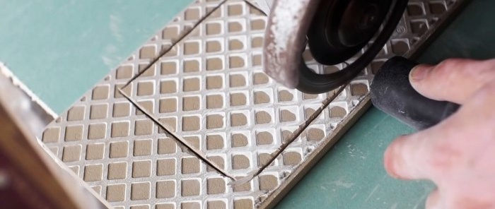 How to use a grinder to make a perfectly even square hole in a tile