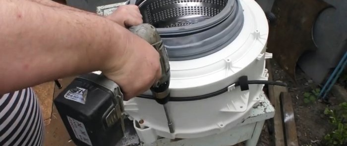 Hoe de as onder de oliekeerring van een wasmachine te herstellen