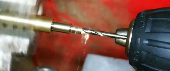 From a brass rod on a lathe we turn a thin hollow tube with external threads along the edges