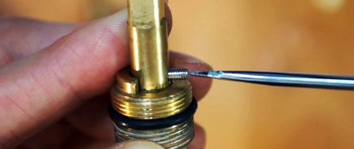 unscrew the side stopper or remove the ring