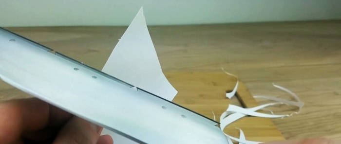 Cutting paper with a knife