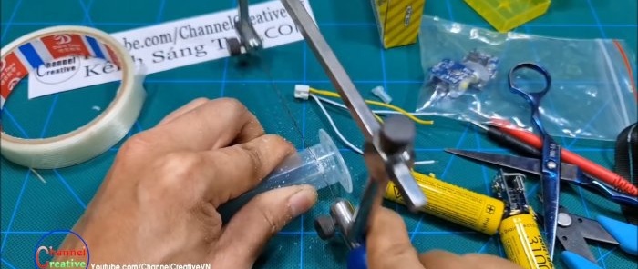 The syringe body is cut to length